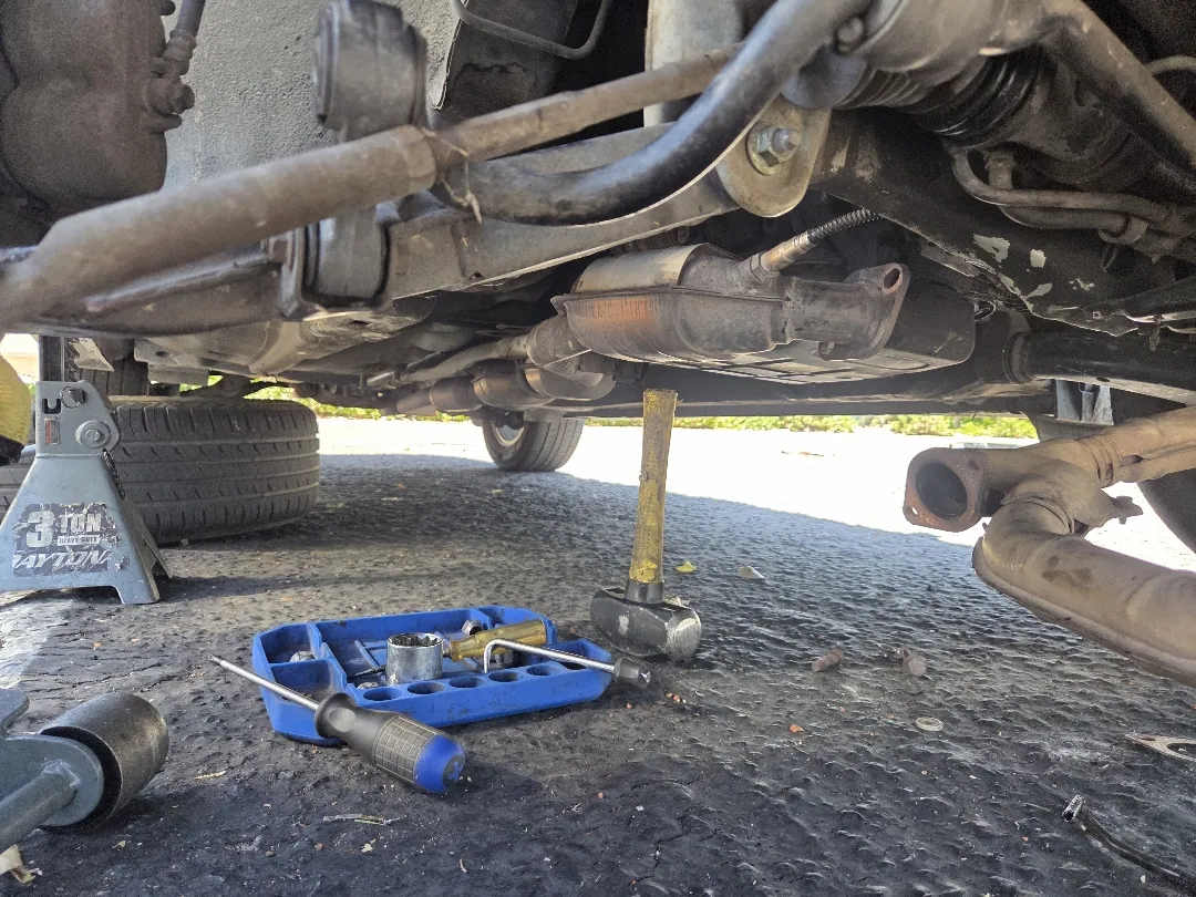 On stands in the customer's driveway, tools laid out on the ground — Moreno Valley, CA