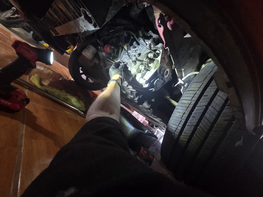 Inspection light in the wheel arch, checking the case and seals before a flush — Moreno Valley, CA