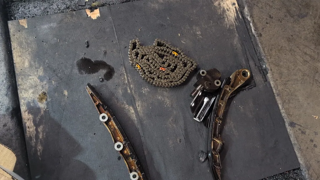 Old timing chain and guides laid out — Hemet, CA